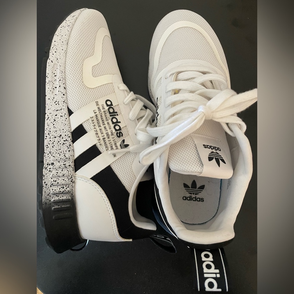 Adidas sneakers, like new. Wore once to try on but never outside.